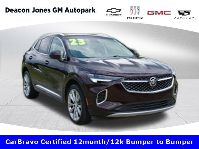 2023 Buick Envision Avenir in Rich Garnet Metallic — front three-quarter view
